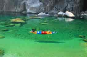 Umngot River at Shnongpdeng: One of most visited tourist attractions in Meghalaya. Known for boating on super crystal clear water along with stunning rock structures of the riverbed and the canyon walls.